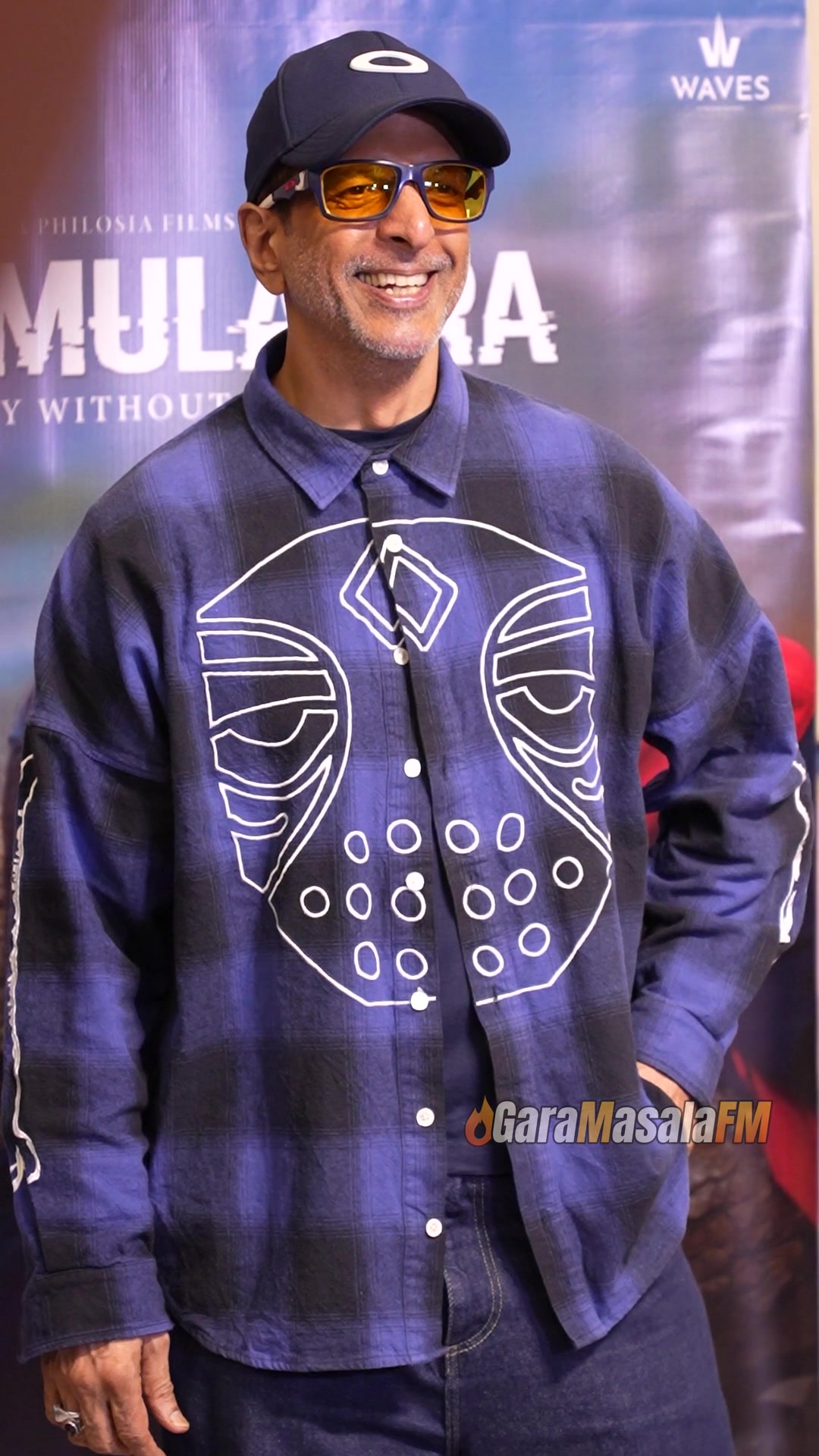 Javed Jafry photographed by paparazzi at the screening of Simulacra.