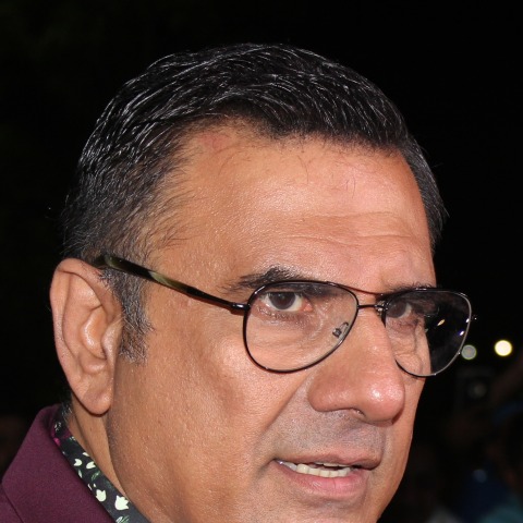 Boman Irani at an event, smiling at the camera