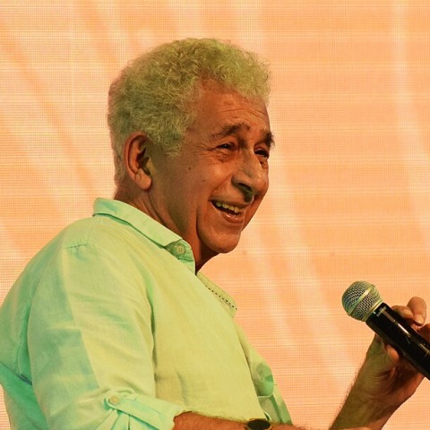 Naseeruddin Shah at a media event, looking serious