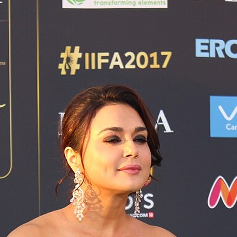 Preity Zinta at a public event, smiling at the camera