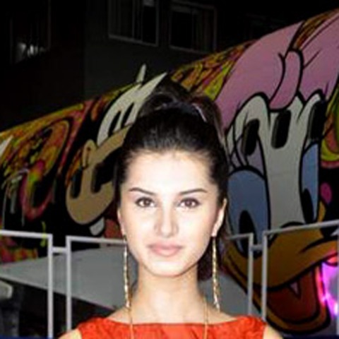 Tara Sutaria smiling at a promotional event
